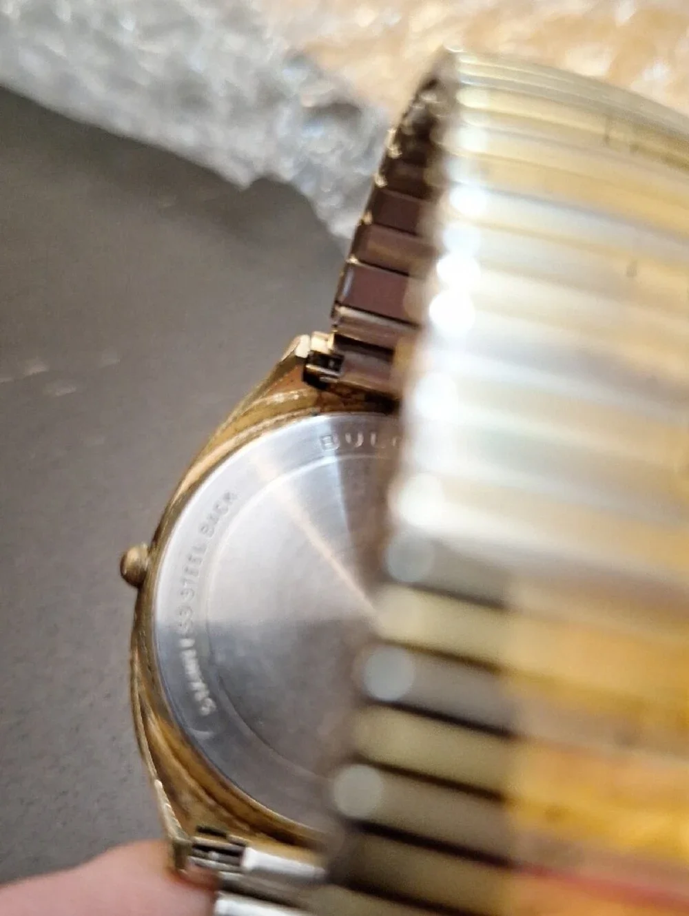 Bulova Gold and White Dress Watch with Roman Numerals‎